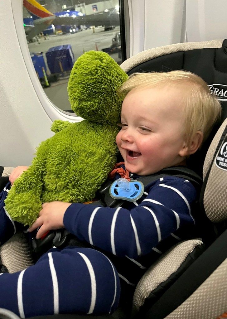 Smiling baby dark onesie. 